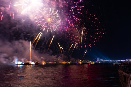 Real fireworks display on the Bosphorus strait. Celebration of national holidays of Turkiye. 100th anniversary of the republic of Turkiye concept photo. Istanbul Turkiye - 10.29.2022のeditorial素材