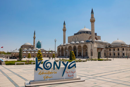 Landmarks of Konya with a sign. Tomb of Rumi and Sultan Selim Mosque. Konya Turkiye - 5.18.2022のeditorial素材