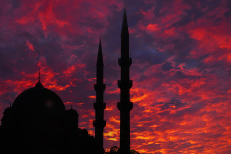 Islamic concept image. Silhouette of a mosque with dramatic clouds at sunset. Ramadan kareem or eid mubarak or kadir gecesi or laylat al-qadr background.の写真素材