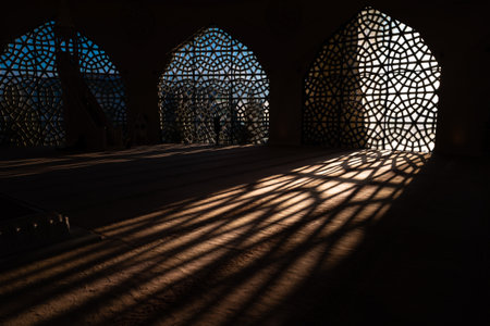 Islamic concept photo. Islamic pattern on the window and shadows on the ground. Ramadan or islamic...