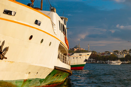 Istanbul background photo. Ferries and cityscape of Istanbul. Hagia Sophia or Ayasofya on the background.の写真素材
