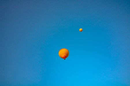 Hot air balloons on the sky at sunrise. Visit Cappadocia concept photo.の写真素材