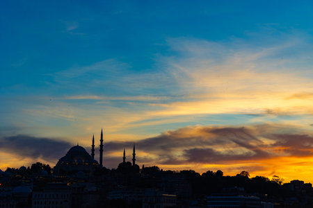 Ramadan or islamic concept photo. Silhouette of Mosque with dramatic sky at sunset.の写真素材