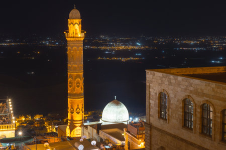 Mardin ulucamii or Great Mosque of Mardin at night. Mesopotamia in the background.の写真素材