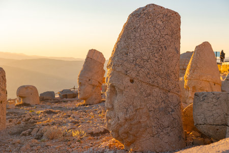 Zeus statue in Mount Nemrut at sunset. Nemrut mountain national park in Adiyaman Turkey.の写真素材