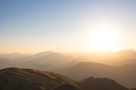 Landscape of the mountain range at sunset with haze and clear sky viewed from Mount Nemrut.の写真素材