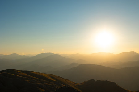Silhouette of the mountain range at sunset.の写真素材