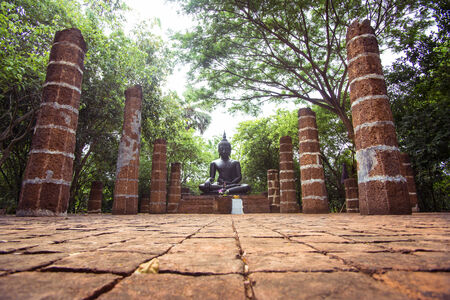 Peaceful ancient temple with Buddha statue の写真素材