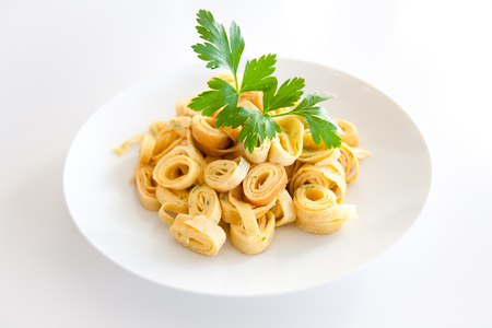 Traditional Austrian soup dish called fries isolated on a white plateの写真素材