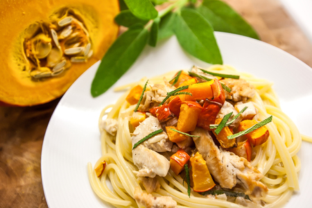 Spaghetti with roast butternut squash, meat and sage. Original italian Pastaの写真素材