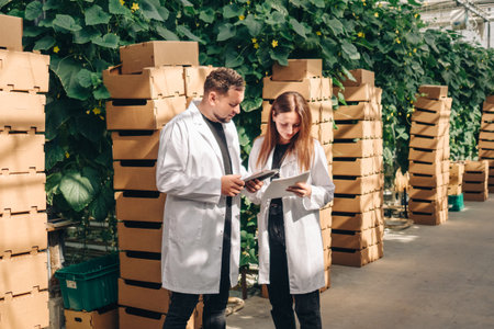 Experts examine farming statistics thoroughly, Agriculture specialists carefully evaluate plant and...