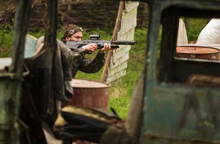 Play laser tag on a special testing ground in spring forest. Vitebsk, Belarus 2015