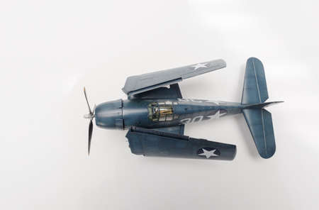 Plasitc model of The Grumman Hellcat monoplane at US Navy service on white background.