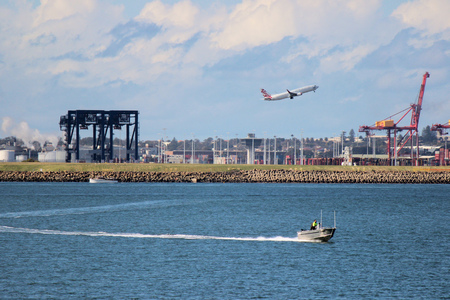 airline and boat with industrial zone in sydneyのeditorial素材