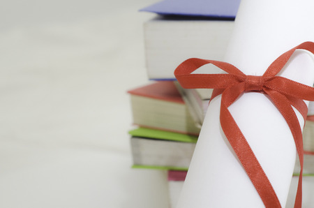 Diploma On the pile of booksの写真素材