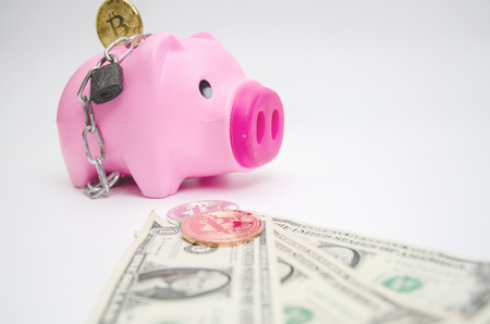 Piggy Bank Pink and cyber coins and banknotes on white.Save and make a better lifestyleâ concept.Do not focus on objects.の写真素材