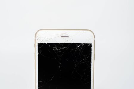 Phone, broken phone or broken screen Place isolated with a white background.の写真素材