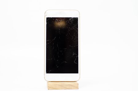 Phone, broken phone or broken screen Place isolated with a white background.の写真素材