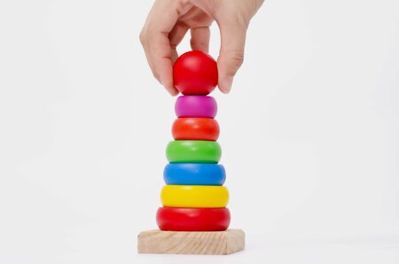 Wooden toys are red, green, yellow, and blue. Many numbers arranged beautifully. Red round wood...