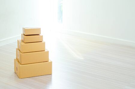Many brown boxes placed on a white background.Copy space.
