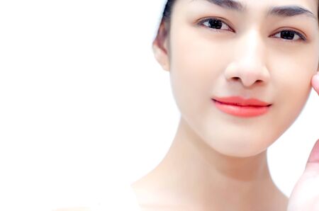 Pretty Asian Woman Hand loops at her face.White cloth girl on the head.Isolated on white background.の写真素材