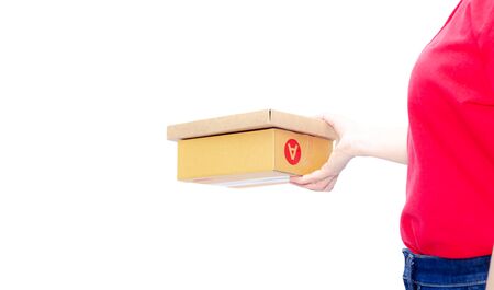 Asian women in a red shirt, blue pants, she smiled and held several brown boxes at the same time isolated white background.Women send parcels.の写真素材