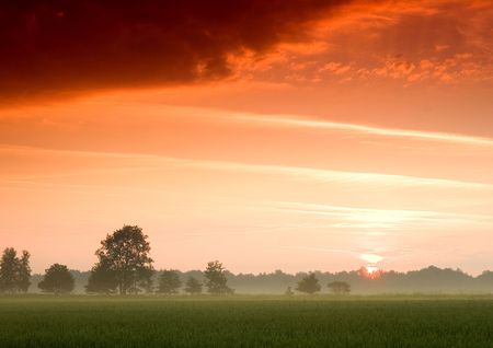 Beatiful and calm sunrise. Colourful landscape.の写真素材