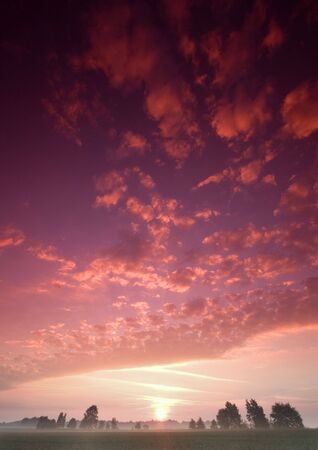 Beatiful and calm sunrise. Colourful landscape.の写真素材