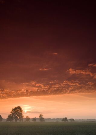 Beatiful and calm sunrise. Colourful landscape.の写真素材