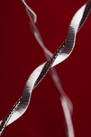 Silver jewelery over red backgroundの写真素材