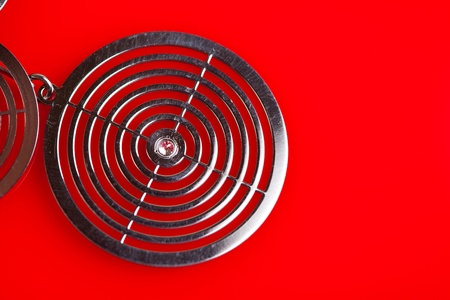 Silver jewelery over red backgroundの写真素材