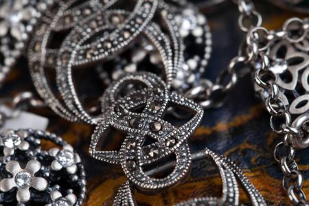 Silver jewelery over backgroundの写真素材