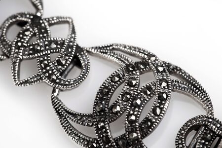 Silver jewelery over background