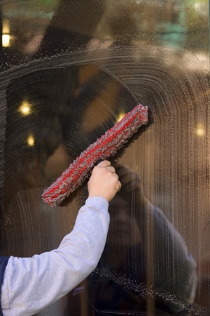 cleaner is cleaning the window