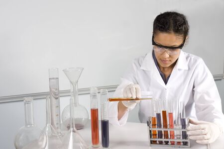 Female lab tech mixing liquids