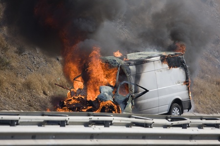 Burning van with large flames and black smoke のeditorial素材