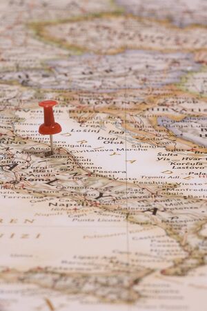 Red pushpin showing the location of a destination point on a mapの写真素材