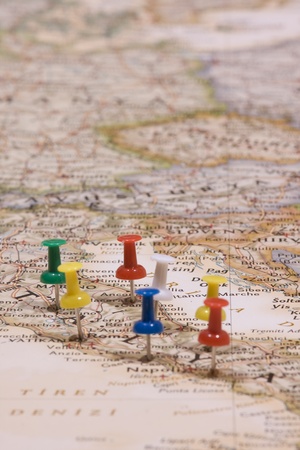 different color of pushpins showing the location of a destination point on a map