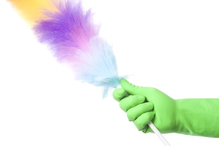 Hand with green glove holding cleaning product; isolated on white の写真素材
