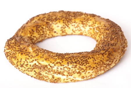 The Turkish bagel strewed by sesame seeds on white background