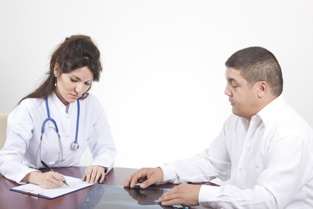 patient with nurse sit at table on whiteの写真素材