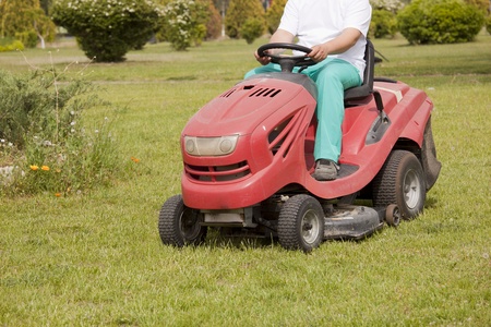Ride-on lawn mower cutting grass