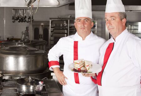 Two chefs at work in a restaurant の写真素材
