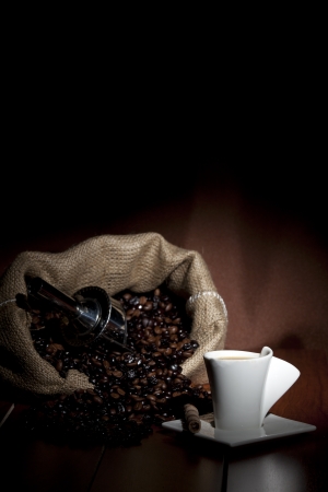 cup of coffee with grains on a dark background の写真素材