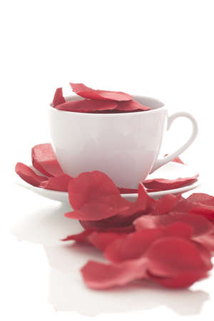 Coffee cup and rose petals の写真素材