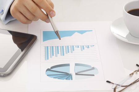 financial charts and graphs on the tableの写真素材