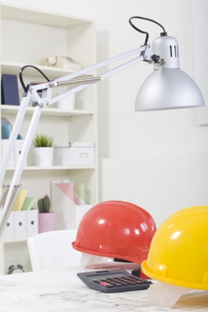 Hardhat  and measuring instruments on blueprintの写真素材
