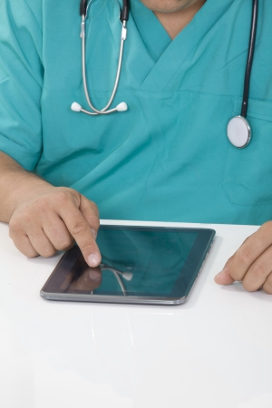 Doctor working on a digital tabletの写真素材