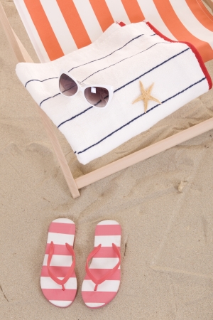 beach chair with colorful towels and toysの写真素材