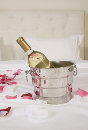 wine in bed to celebrate Valentineの写真素材
